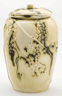 A covered jar with high-relief grapes.