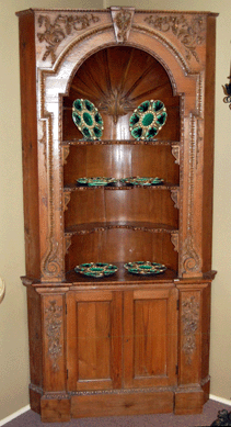 The Nineteenth Century pair of French pine corner cupboards, one shown, was $5,750.
