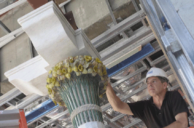 John Griswold, head conservator, inspects one of the capitols from the Daffodil Terrace in the Morse's new exhibition area.