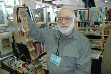 Bruce Gventer, owner of B&S Gventer Books & Ephemera, South Egremont, Mass., was one of about two dozen antiquarian book and ephemera dealers represented in a popular new section at this show †Book Alley. He is shown unfurling a Nineteenth Century medicine man's book of recipes rendered on tree bark, one of the highlights in his booth. The miniature book featured a carved salamander on the cover, a symbol of prosperity.