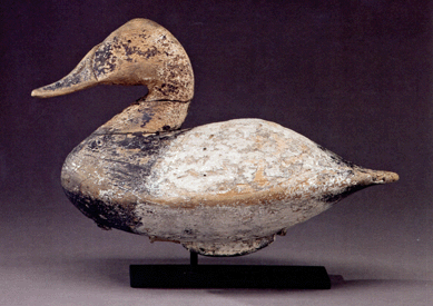 The Lee Dudley, Knott's Island, S.C., canvasback drake decoy in worn original paint did well at $80,500.