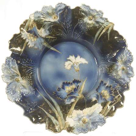 Vying for top lot, this R.S. Prussia 15-inch Carnation mold centerpiece bowl, cobalt blue with floral décor, achieved $4,300.