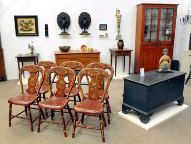 A wonderful set of balloon back Pennsylvania paint decorated chairs in vibrant red from the booth of Joseph Lodge, Lederach, Penn.