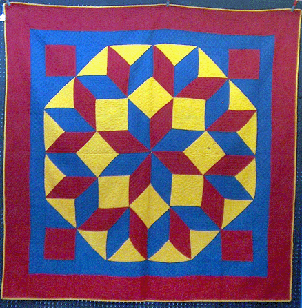 Kramer offered a crib quilt in a star on compass rose pattern.