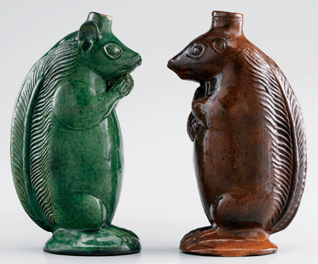 A pair of squirrel bottles, Salem, N.C., circa 1804‱829, 8¼ inches tall.