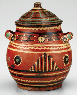 This sugar pot made in Almance County between 1790 and 1810 is among the most refined example of hollowware from the St Asaph's tradition. In a 1935 article for The Magazine Antiques, Joe Kindig Jr claimed to have found several pots in the early 1930s that still contained sugar. The York, Penn., antiques dealer noted the distinctive shape of the North Carolina examples, which he said had rounder sides, smaller mouths and less vertical handles than Pennsylvania vessels. Lead-glazed earthenware, diameter 10 inches. Old Salem Museums & Gardens.