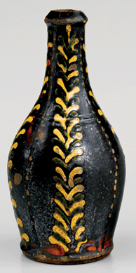 Recent research indicates that non-Moravian potters working in and around the St Asaph's district of what is now southern Almance County, N.C., made pieces such as this bottle, which dates to between 1790 and 1820. Lead-glazed earthenware, height 6 inches. Private collection.