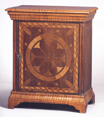 A Pennsylvania tiger maple and walnut spice box with ten interior tiger maple drawers around a central walnut drawer went for $106,500.