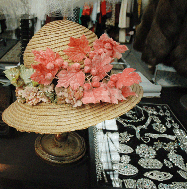 This spring "bonnet,†probably from the 1940s, in straw and heavily accented with silk and velvet flowers, leaves and buds, was among the many examples of fashionable ladies' headgear shown by Lisa Victoria Vintage Clothing, Bogota, N.J.
