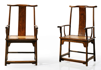 A pair of huanghuali yoke back armchairs (guanmao yi), Seventeenth Century, realized  $2,770,500.