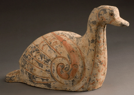 Much of the original, colorful paint remains on this small, resting goose, one of a number of excavated miniature earthenware animals recalling the agricultural prosperity of peaceful and unified Han China. Showcasing a high level of artistic craftsmanship, a painted spiral leads into rows of scalelike patterns painted in red, representing feathers, and its wings reach toward a tail that is extended to steady the base. Xi'an Municipal Museum ©Shaanxi Provincial Cultural Relics Bureau and the Shaanxi Cultural Heritage Promotion Centre, People's Republic of China, 2009.