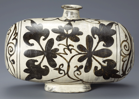 This iron painted drum-shaped bottle with peony decoration is one of the most powerful examples of buncheong's organic form and abstraction. It is Korean National Treasure No. 1387. Leeum, Samsung Museum of Art, Seoul. Image courtesy Leeum, Samsung Museum of Art.