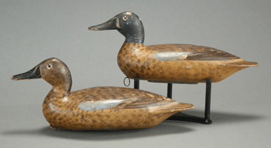 A pair of blue-winged teal decoys by Robert Elliston sold for $103,500.