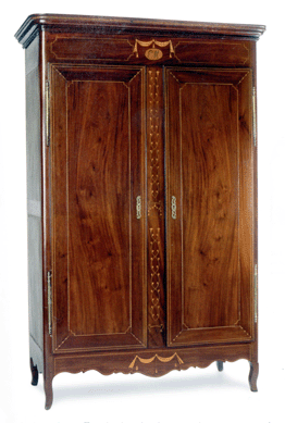 A Creole mahogany armoire with secondary walnut, cypress and tulip poplar is one of the grander Butterfly Man examples, with graceful inlay and a finished interior with four shelves and four drawers. Mr and Mrs Robert J. Patrick, New Orleans.