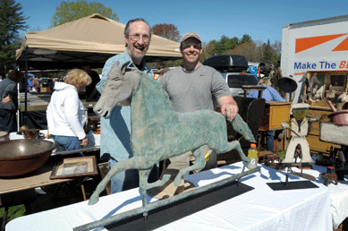 Gregory Getner and dealer Scott Martin, Lenox, Mass., with an oversized horse weathervane. ⁍ay's