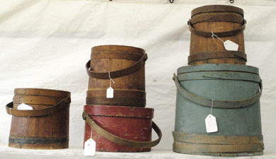 Primitive firkins made for an attractive display at M&J Antiques, Pomfret Center, Conn. ⁈ertan's
