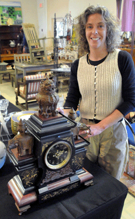 Auctioneer Diana Onyshkewych with the rare Tiffany Chinese bronze and marble pagoda clock that sold for $4,887.