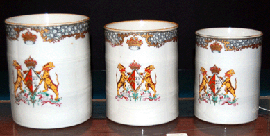 Three graduated Chinese Export armorial porcelain mugs with Larker impaling Nesbett coat of arms, circa 1760, realized $6,325.