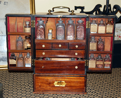 A Nineteenth Century English mahogany medicine cabinet with bottles and drawers filled with chemists' items has a secret drawer. It sold for $5,750.