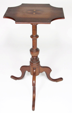 New England candlestands are perennially attractive. The example pictured, a Queen Anne cherry piece, realized $4,600.