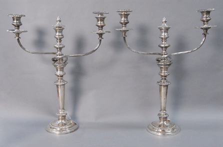 Two of a set of four English sterling candlesticks with two silver plated candelabra arms marked with English hallmarks for Thomas and James Settle, Sheffield, 1825. 