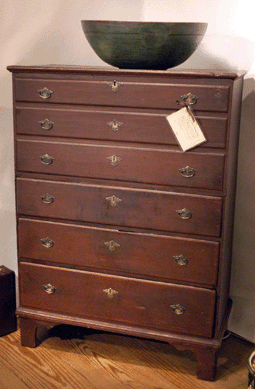 Hanes & Ruskin, Old Lyme, Conn., showed this untouched late Eighteenth Century Massachusetts tall chest, circa 1790, that has never been repainted. Similar examples are on view at Historic Deerfield.