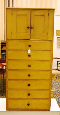 The Mount Lebanon pine cupboard over drawers sold on the phone for $28,910. 