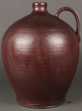 This sine wave stoneware jug, marked "J. Mort,†from a previously unrepresented family of Tennessee potters, reached $23,000. 