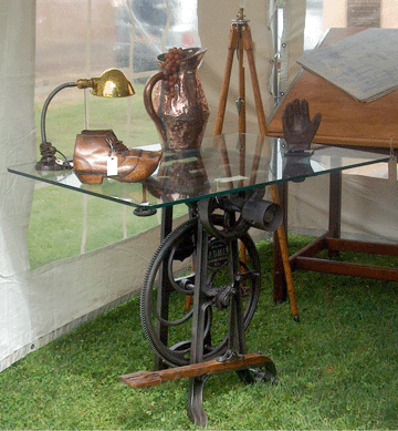 An early foot pedal-activated circular saw was converted by Jerry Bonk to a cocktail table. Bonkey's Treasures, Hellertown, Penn.