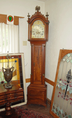 An Eighteenth Century American tall clock with an English dial from the estate of Boston antiques dealer Fred Finnerty, realized $14,375.