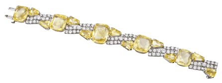 Platinum, yellow sapphire and diamond bracelet mounted with five cushion-cut Ceylon yellow sapphires, approximately 60.53 carats, 10 keystone-cut yellow sapphires ap-proximately 8.61 carats and 75 round brilliant-cut diamonds approximately 5.90 carats; signed OH, designed by Oscar Heyman & Brothers. Courtesy Betteridge Jewelers on be-half of private collector. ⁂etteridge Jewelers photo