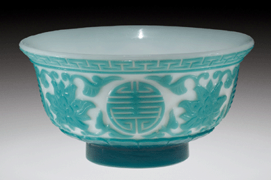 A rare cutback overlaid blue to white tea bowl with foliate designs, circa 1750‱795, China. Bequest of Jerome Strauss.