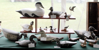 A selection of the carved waterfowl decoys offered by Rhode Island dealer Raven's Way Antiques.