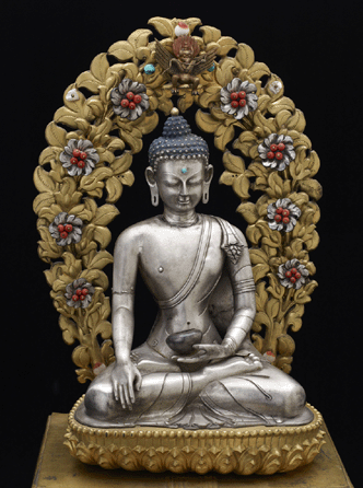 Shakyamuni Buddha in a full shrine, Qing, probably Dolonnnor, second half of the Eighteenth to early Nineteenth Century, silver repousse image with turquoise urna, floral mandorla with leaves of gilt copper and flowers of silver with coral and mother-of-pearl, heavily gilded bronze lotus seat and base with inset turquoise, coral, and lapis lazuli, 23 by 12 inches. Image courtesy of the Freer and Sackler Galleries.