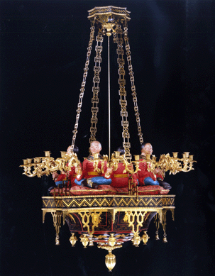 Ronald Phillips, owned by Simon Phillips, co-founder of Masterpiece London, sold a Regency brass and polychrome japanned copper 24-arm chandelier. The piece is in the manner of Henry Holland and dates from circa 1825.
