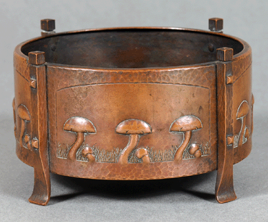 A Karl Kipp handwrought copper fern dish, circa 1912, was made with four panels decorated with mushrooms amid incised grass.