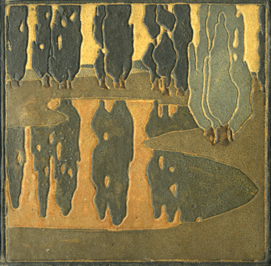 A Marblehead Pottery tile was decorated by Arthur E. Baggs with a scene of poplars reflected in a pond.