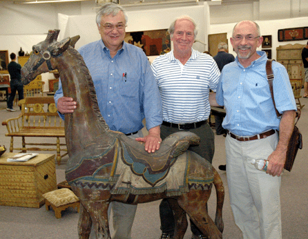 Prior to the sale, Ron Bourgeault, left, and Pat Bell of Olde Hope Antiques, right, joined Steven Kellogg in the exhibition area.