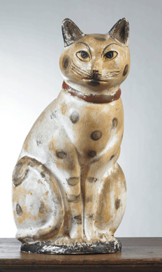 A large hollow-cast, painted and smoke-decorated chalkware cat, Pennsylvania, mid-Nineteenth Century, 15½ inches high, went well over the $8,000 high estimate, selling for $27,140. The provenance lists Stephen-Douglas Antiques.