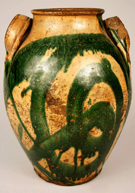 The lead glazed earthenware jar was decorated with brushed copper oxide and is coggled "C.A. Haun No 1†with other decorations around the shoulder. Haun always decorated his name.