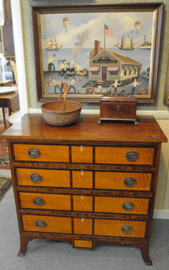 The Hepplewhite cherry swell front chest with bird's-eye maple drawer fronts went out at $3,335, the Nantucket basket was reasonable at $488 and the Cahoon painting realized $46,000.