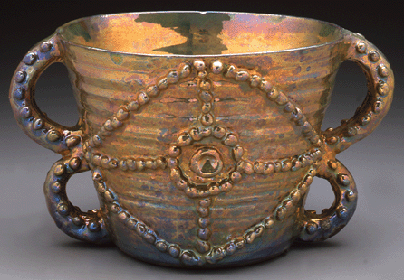 This decorative stacked handled bowl with of copper or gold luster shows how a few balls of clay became art in the hands of the maker. Collection of Carol and Arthur Goldberg. ⁔ony Cunha photo, ©Beatrice Wood Center for the Arts/Happy Valley Foundation