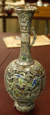Several very special Japanese objects were stars. A beautiful Japanese silver filigree vase with exquisite translucent repousse enamel decoration by Hiratsuka Mohei, circa 1885, brought $11,150 from a phone bidder.