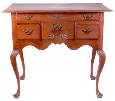 Lot 1269, a fine Connecticut Queen Anne lowboy in cherry, one long drawer over two short drawers, 31½ inches high, 21½ by 36 inches top, case width 30½ inches, had a high estimate of $15,000, but active bidding took the piece to a final bid of $70,800.