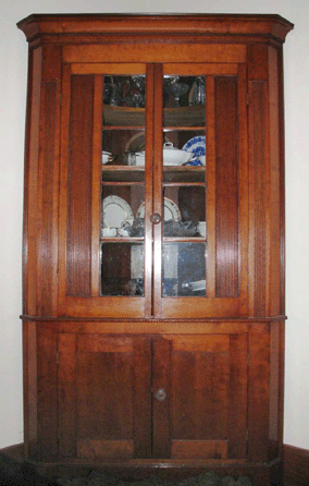 An Eighteenth Century corner cupboard, believed to have been made by Squire Boone, Jr, the younger brother of Daniel Boone, realized $35,000.