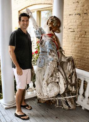 Marine paintings specialist Michael Florio of Quester Gallery in Rowayton, Conn., gives a thumbs up to this 72-inch carved and painted figurehead salvaged from the wreck of the 1863 British clipper ship Coonatto, which served the Australian wool and tea trade until 1876. Planted in the garden of an English manor house, the figure traded hands twice before surfacing at Osona Auction in 2008, where it brought $42,920. Damaged but desirable, it resold for $44,840 to an Australian buyer underbid by West Newbury, Mass., dealer Paul De Coste.