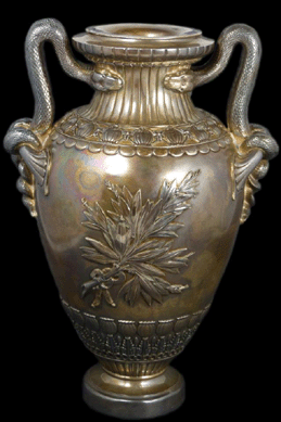 Tiffany & Company sterling silver revival urn with snake handles, 11½ inches tall, brought $8,555.