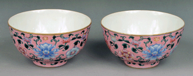 Pair of Chinese porcelain famille rose bowls with floral decoration on rose ground, signed on the bottom, 3 inches high, diameter of 5¾ inches, sold for $8,400.