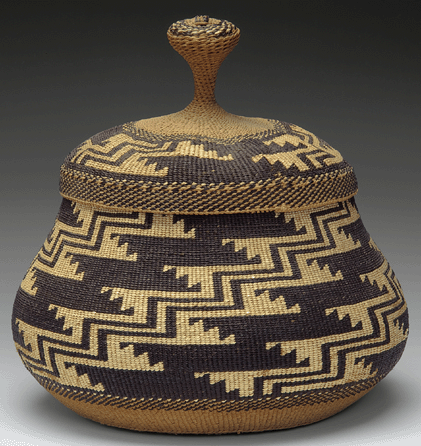 Attributed to Elizabeth Conrad Hickox, Karuk (Karok)/Wiyot, or her daughter Louise Hickox, both of whom were renowned basketmakers and whose works are also in the Smithsonian, this lidded basket, about 1925, of wild grape root, myrtle sticks, hazel, maidenhair fern, yellow-dyed porcupine quills and stag horn lichen embodies the style of California baskets that look to nature for inspiration. Gift of Mrs James Foster Scott in memory of her late husband, Victor J. Evans.