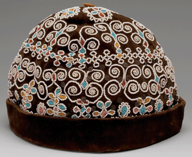 This man's cap made of velvet, cotton cloth, glass beads, sequins, ivory and thread, about 1860, hails from the Mi'kmaq (Micmac), Wabanaki or Haudenosaunee (Iroquois) region, Nova Scotia, New Brunswick, or New York. The cap was purchased in memory of Stacey Coverdale, Class of 1988 by an anonymous gift.